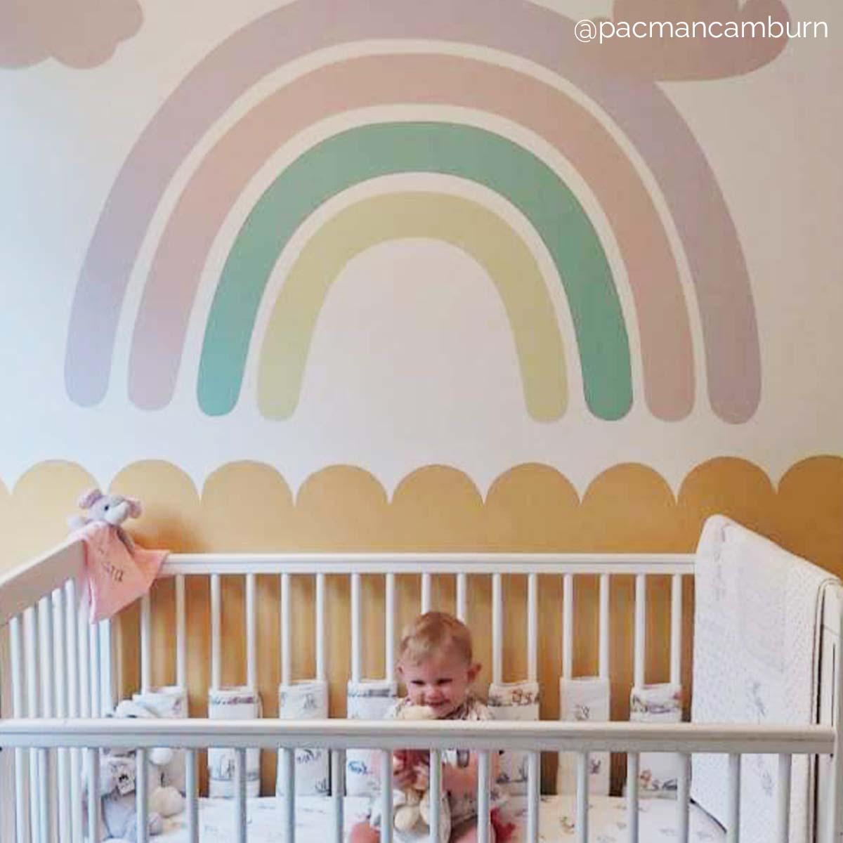 colourful rainbow wall decal in nursery